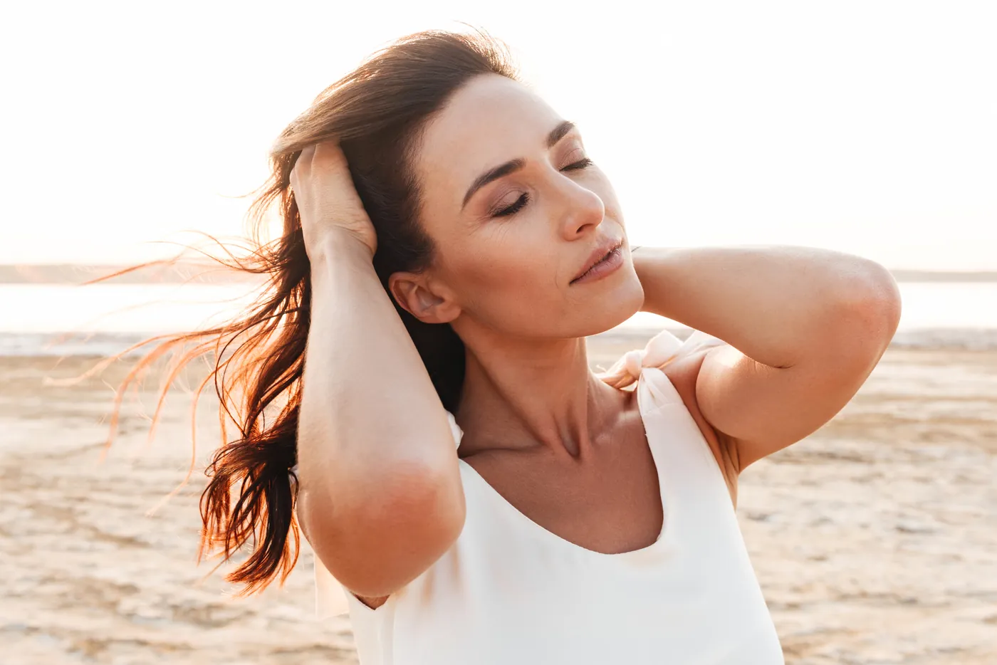 Woman with glowing skin enjoying the sun