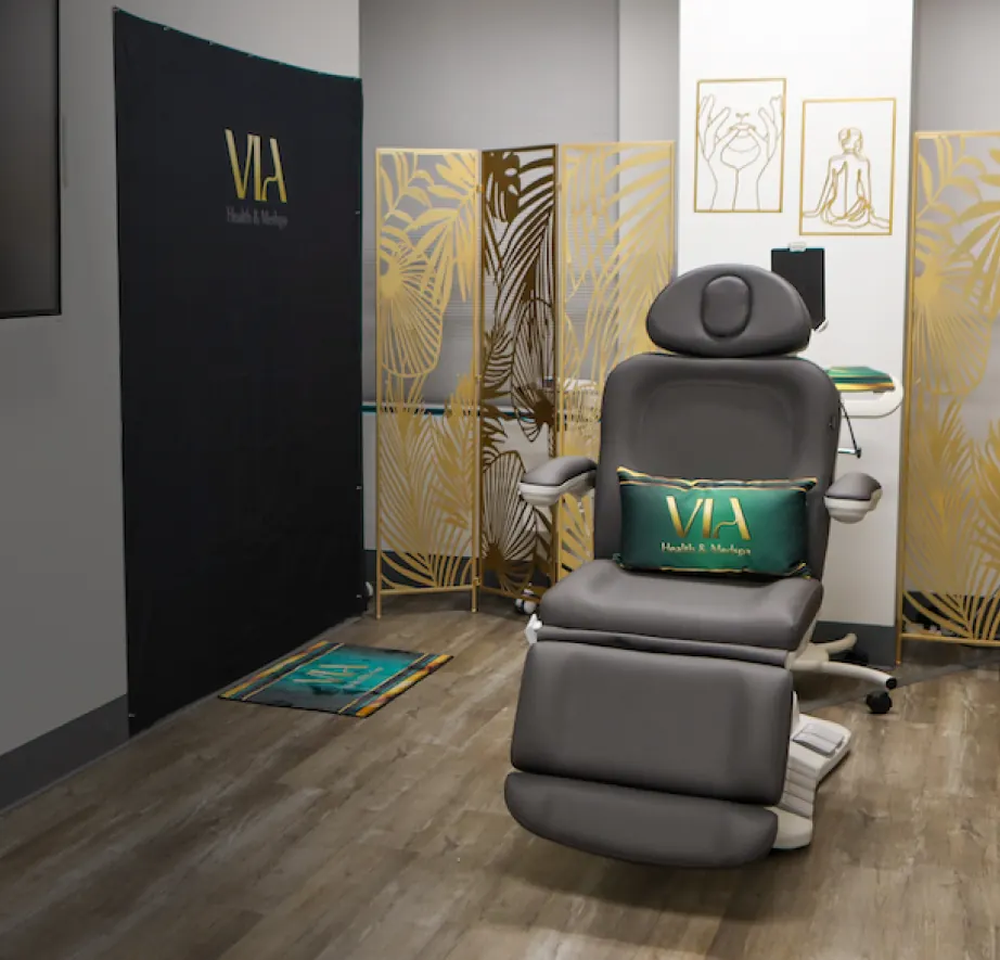 VIA treatment room with gold leaf screens and a treatment chair